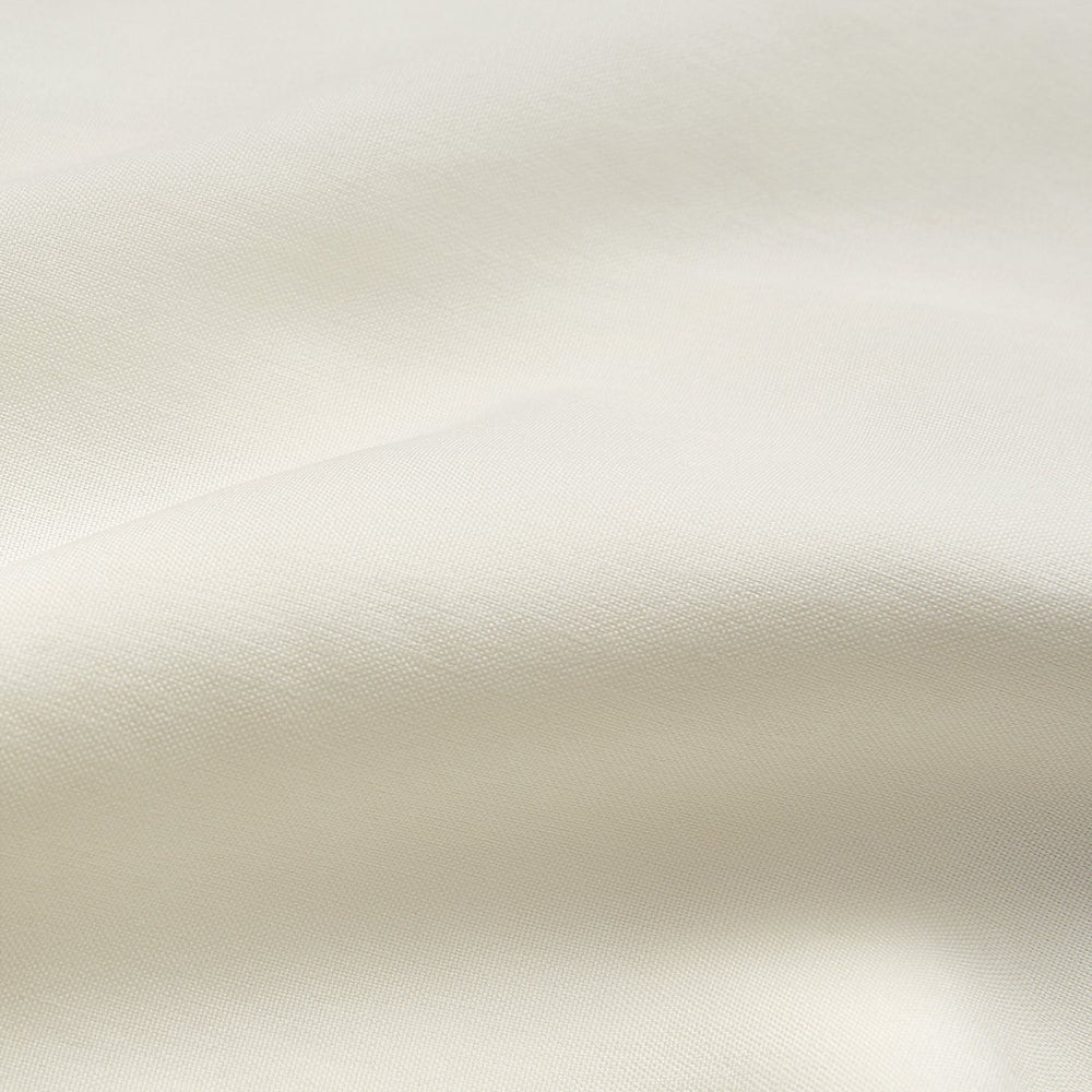 The Turnbull & Asser Turnbull and The Deck Cream Silk Romantic Shirt features long sleeves, a pointed collar, and elegant front ruffles, shown against a plain light gray background.