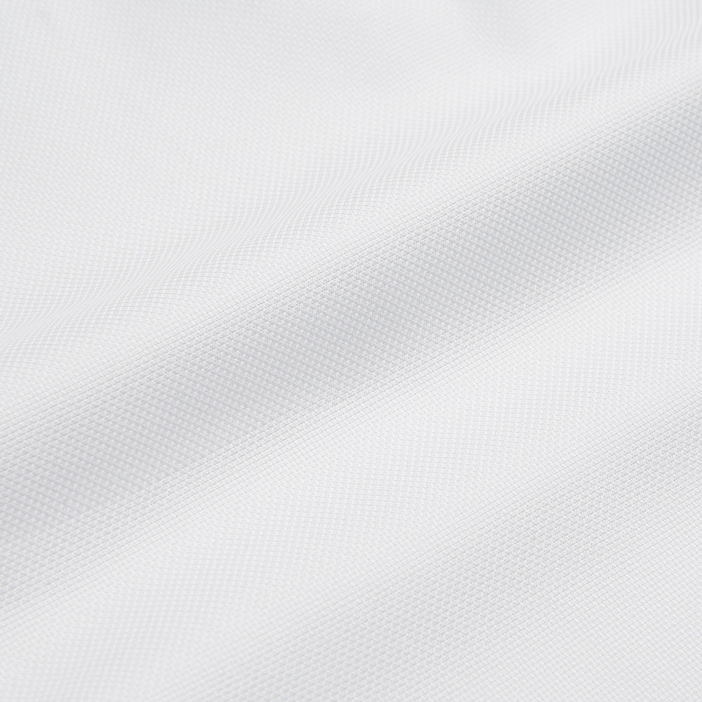 The Turnbull and The Deck White Cotton Traditionalist Shirt by Turnbull & Asser features a classic collar, buttoned front and cuffs, and a refined Royal Oxford weave, shown on a plain light gray background.