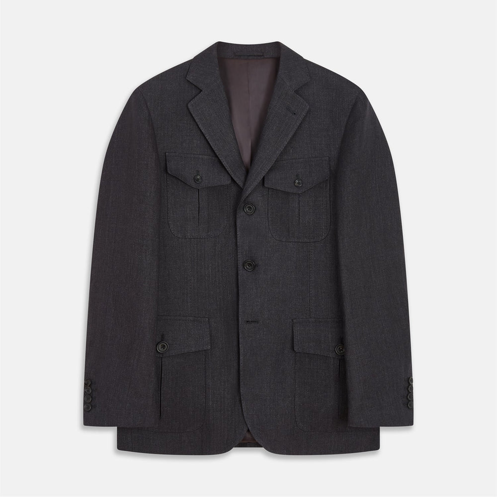 The Turnbull & Asser Charcoal Linen Safari Byron Jacket has a contemporary fit, notched lapel, front button closure, and four flap pockets—two chest and two waist—shown on a plain white background.