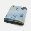 View 7 of product The Pale Blue Wool and Cashmere Lily Blanket by Turnbull & Asser features abstract, hand-drawn designs in blue, yellow, and gray on a white background.
