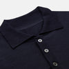 View 2 of product The Navy Merino Wool Cecil Rugby Polo Shirt by Turnbull & Asser features long sleeves, a collar, and a three-button placket—a timeless menswear staple laid flat on a white background.