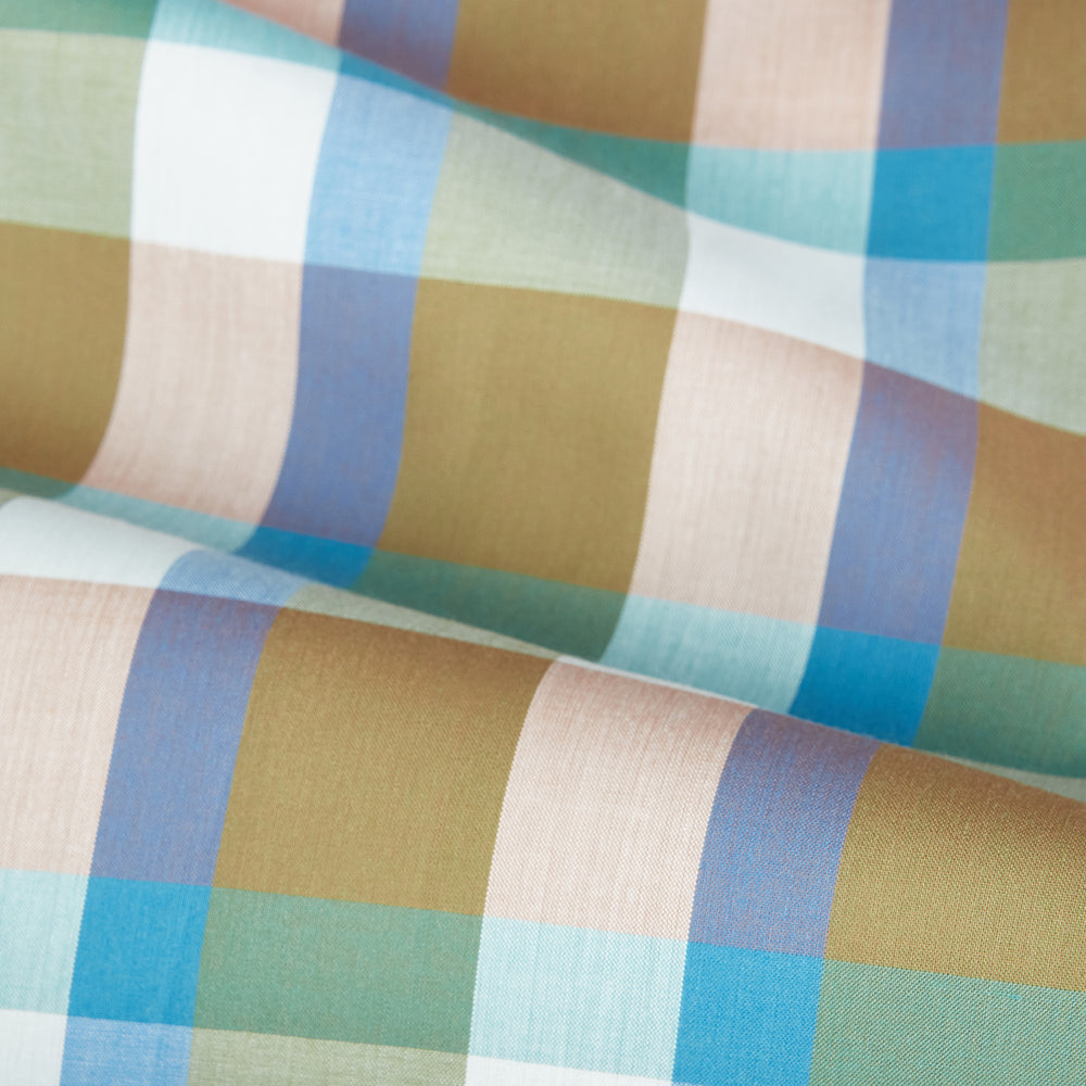 The Green and Pink Multi Check Linen Blend Sussex Nightshirt by Turnbull & Asser is a soft, long-sleeved sleepwear piece with a colorful plaid pattern, button-down front, chest pocket, and rounded hem—ideal as stylish luxury nightwear.