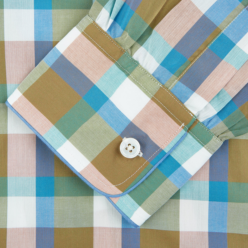 The Green and Pink Multi Check Linen Blend Sussex Nightshirt by Turnbull & Asser is a soft, long-sleeved sleepwear piece with a colorful plaid pattern, button-down front, chest pocket, and rounded hem—ideal as stylish luxury nightwear.