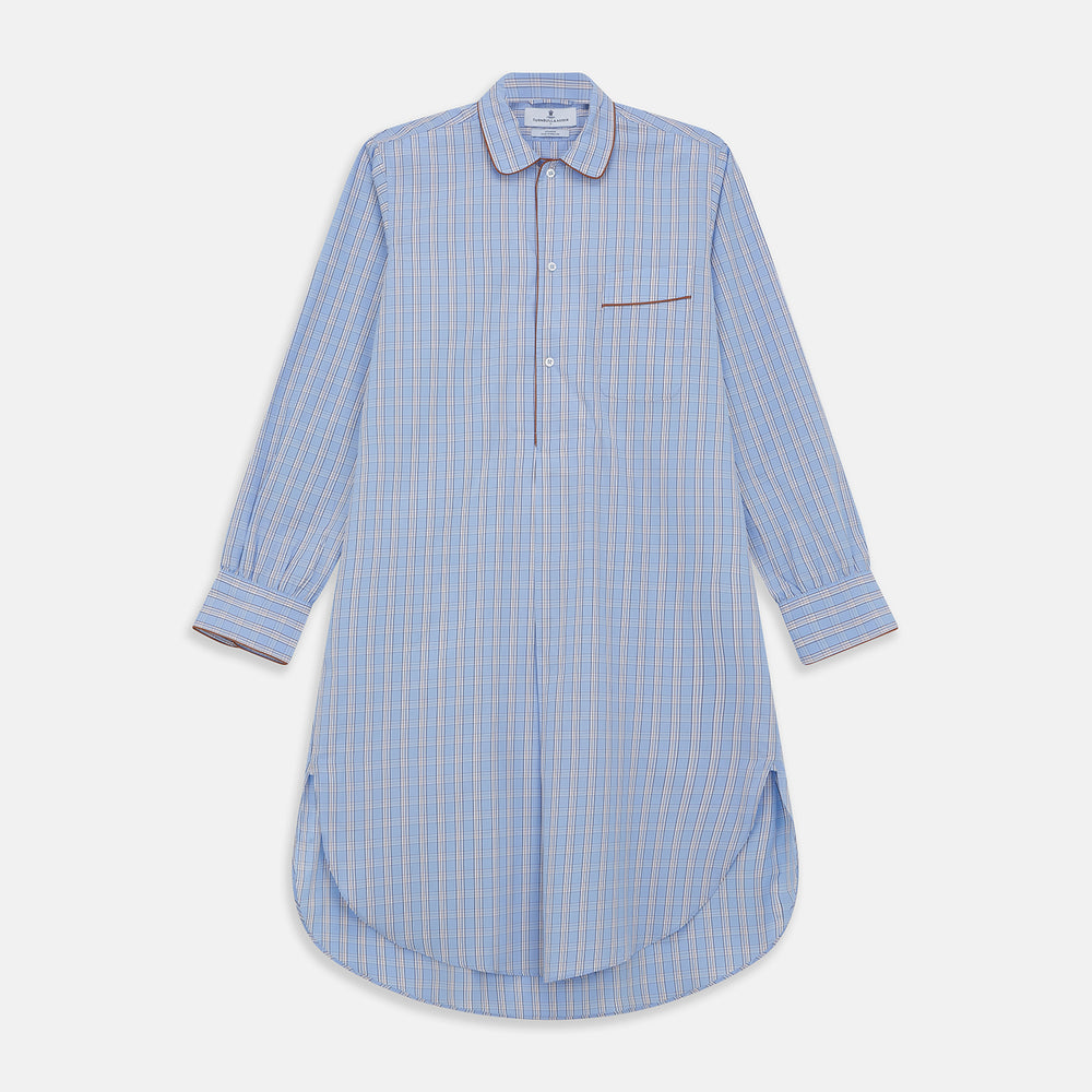 The Turnbull & Asser Pale Blue Multi Check Cotton Sussex Nightshirt features a classic plaid pattern, brown piping accents, button-down front, chest pocket, and curved hem—a timeless long-sleeve sleepwear essential.