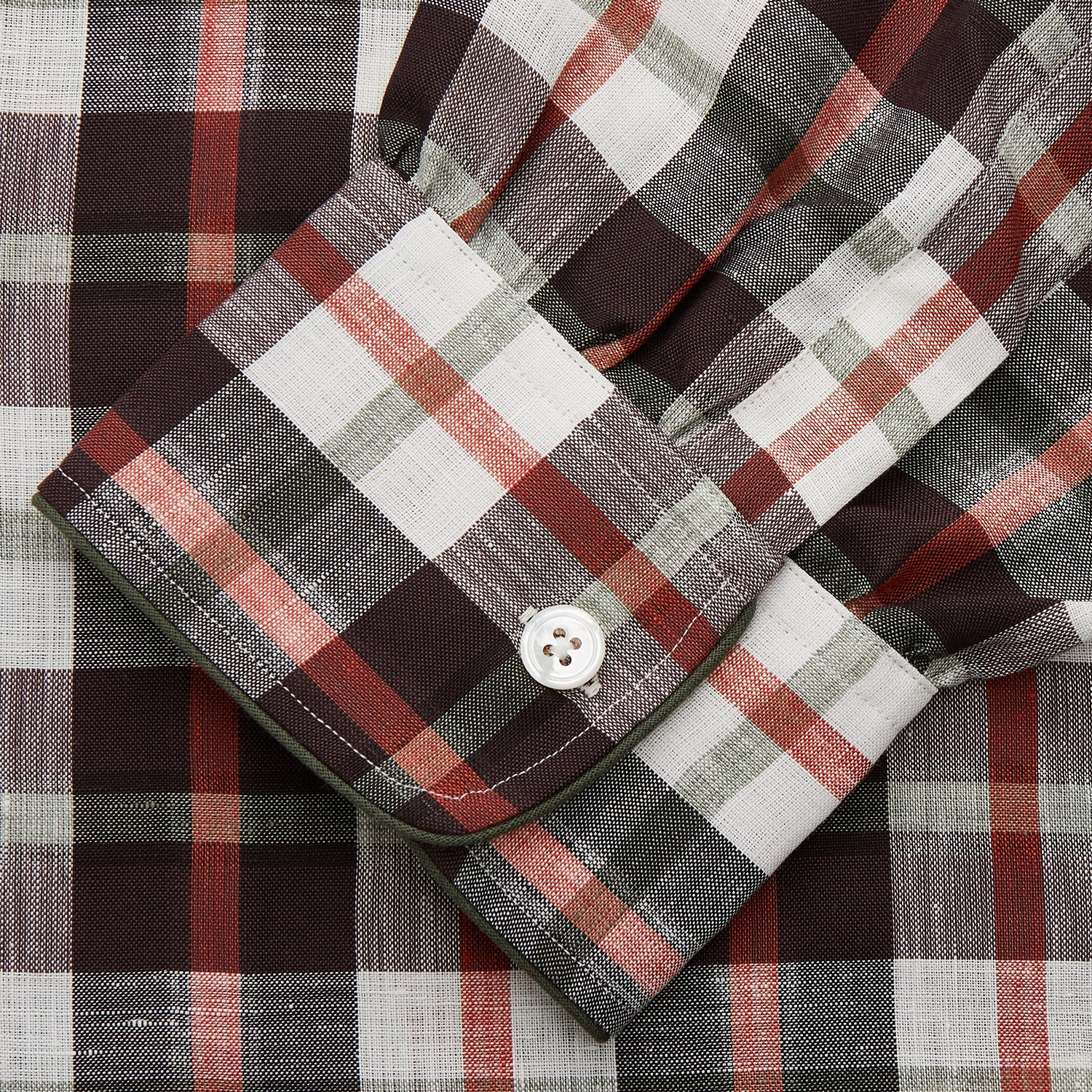 View 3 of product The Black Multi Check Linen Blend Sussex Nightshirt by Turnbull & Asser features a red, black, and white check pattern, button-down front, chest pocket, curved hemline, and brings a luxurious touch to classic sleepwear style.