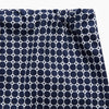 View 2 of product Turnbull & Asser Navy Motif Cotton and Silk Blend Duffield Pyjama shorts feature an all-over white polka dot pattern and a drawstring waist, shown laid flat on a white background.