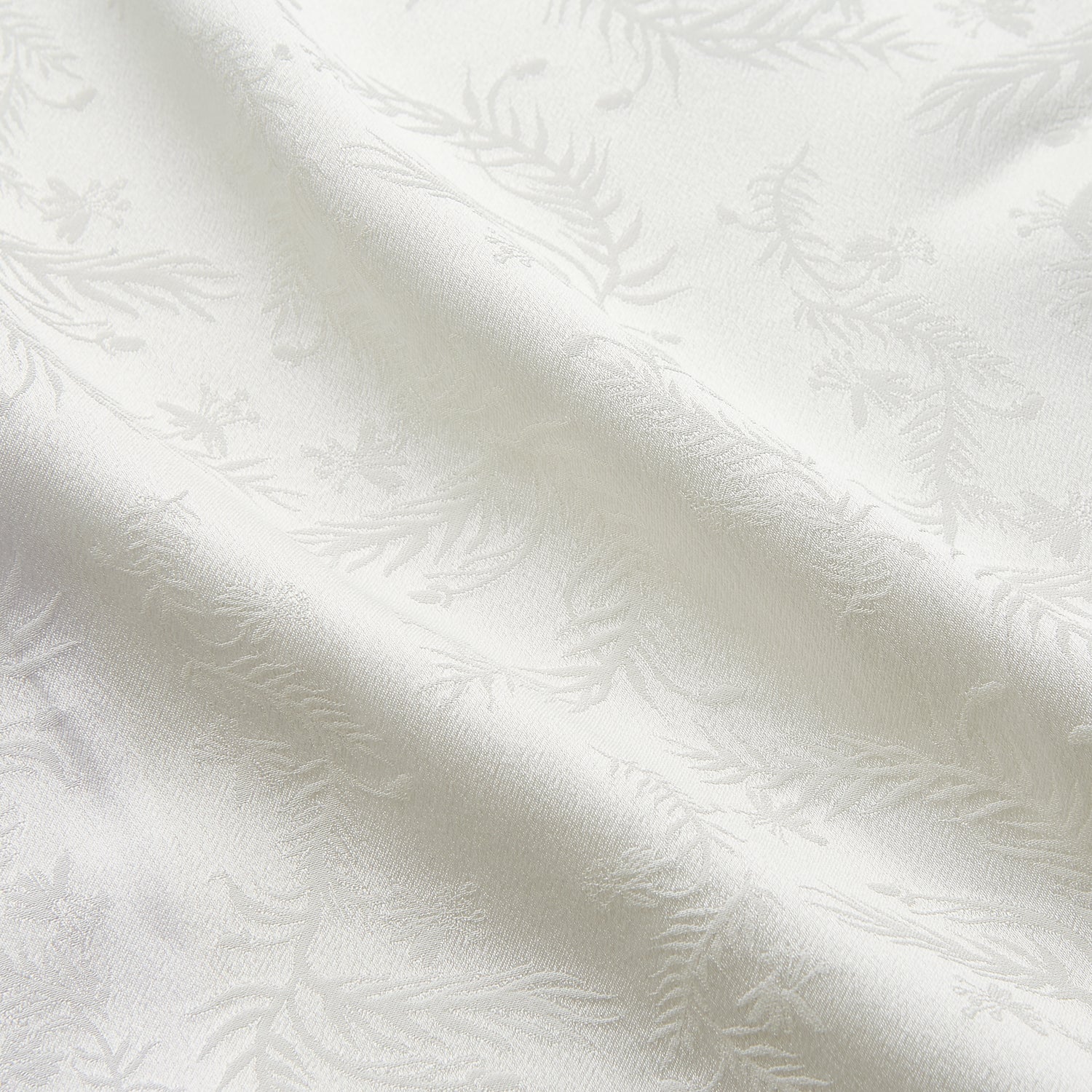 View 2 of product The Cream Floral Pattern Silk Harriet Women's Pyjama Set by Turnbull & Asser features long sleeves, pants, dark piping, a chest pocket, and luxurious silk fabric with a cream floral design, shown on a plain white background.