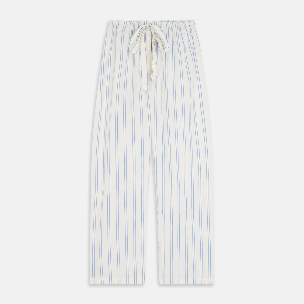 The Turnbull & Asser Women's Blue Multi Cotton Thelma Pyjama Set features a long-sleeve button-up shirt with collar and pocket, plus matching drawstring pants, elegantly displayed against a white background.