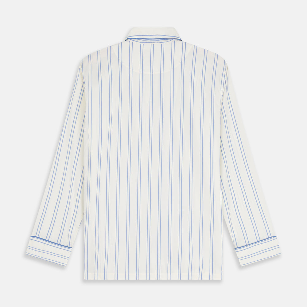 The Turnbull & Asser Women's Blue Multi Cotton Thelma Pyjama Set features a long-sleeve button-up shirt with collar and pocket, plus matching drawstring pants, elegantly displayed against a white background.