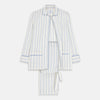 View 1 of product The Turnbull & Asser Women's Blue Multi Cotton Thelma Pyjama Set features a long-sleeve button-up shirt with collar and pocket, plus matching drawstring pants, elegantly displayed against a white background.