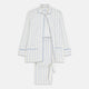 The Turnbull & Asser Women's Blue Multi Cotton Thelma Pyjama Set features a long-sleeve button-up shirt with collar and pocket, plus matching drawstring pants, elegantly displayed against a white background.
