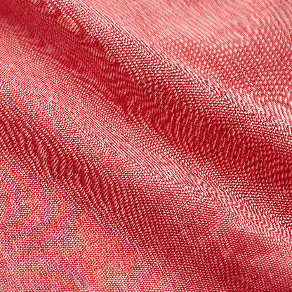 The Pink Linen Arnold Gown by Turnbull & Asser features white piping, long sleeves, a shawl collar, chest pocket, and a wrap-around belt tied at the waist, shown on a white background.