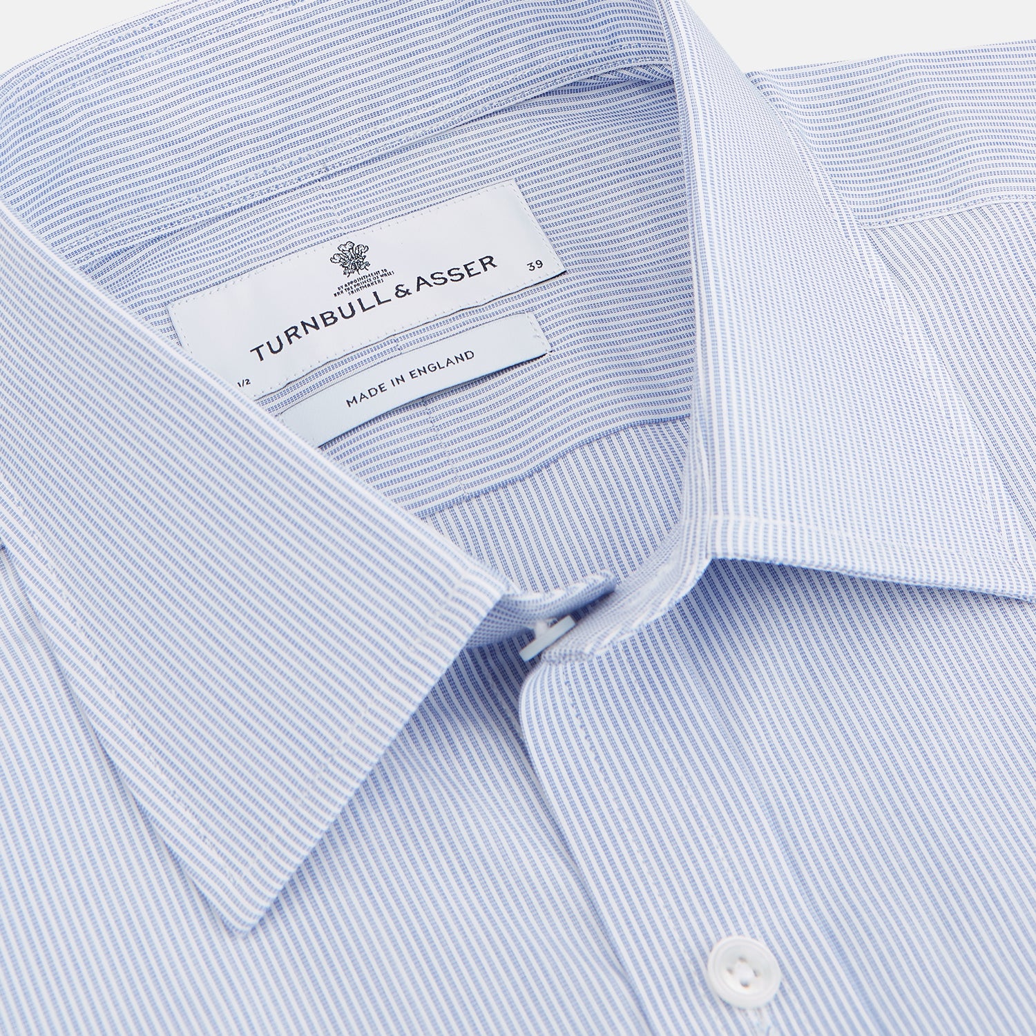 View 3 of product The Turnbull & Asser Blue and White Stripe Cotton Regular Fit Mayfair Shirt features long sleeves, a T&A collar, white buttons, and buttoned cuffs, displayed flat on a white background.