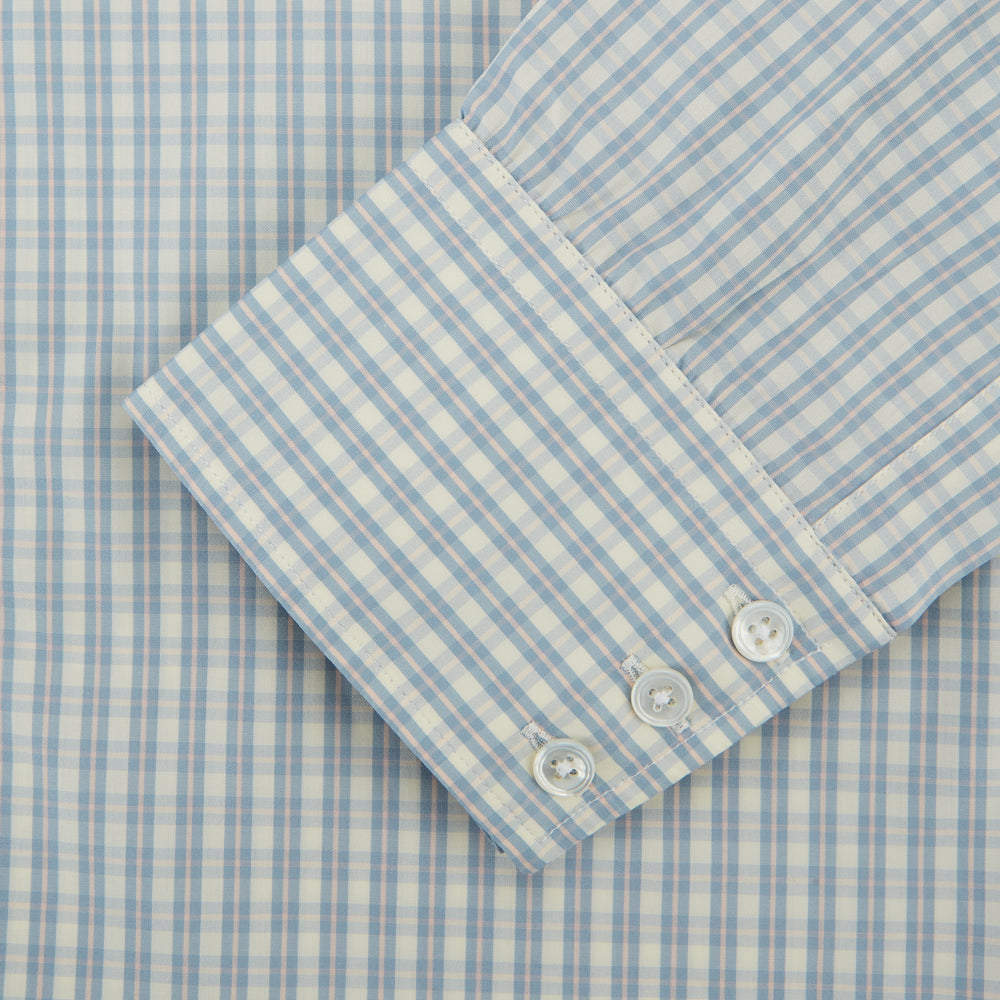 The Turnbull & Asser Pale Blue Multi Check Cotton Regular Fit Mayfair Shirt features long sleeves and a button-up front, displayed against a plain white background.