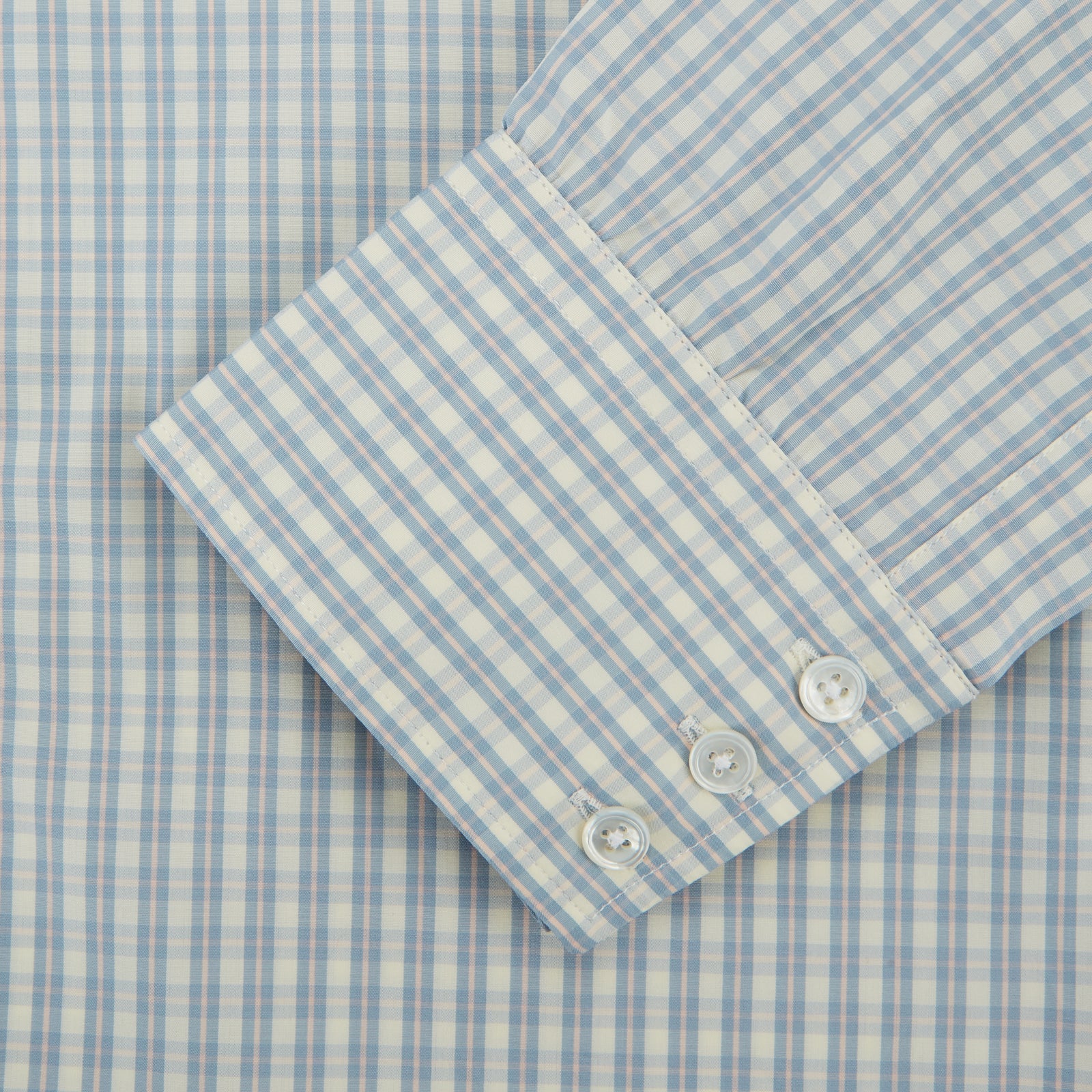 View 3 of product The Turnbull & Asser Pale Blue Multi Check Cotton Regular Fit Mayfair Shirt features long sleeves and a button-up front, displayed against a plain white background.