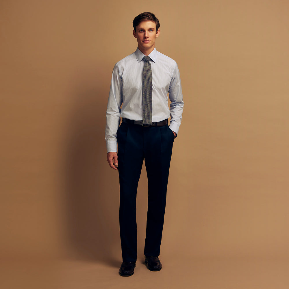 The Turnbull & Asser Pale Blue Stripe West Indian Sea Island Cotton Regular Fit Mayfair Shirt features long sleeves, a button-down front, and a classic collar—an essential for any men's wardrobe, shown on a plain white background.