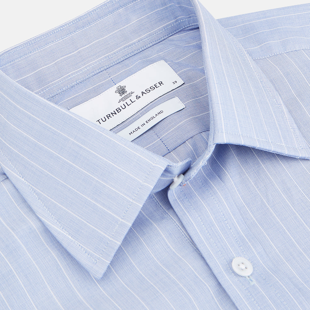 Navy Turnbull & Asser Mayfair shirt in textured cotton, regular fit with a sharp T&A collar and white buttons, laid flat on a white background.