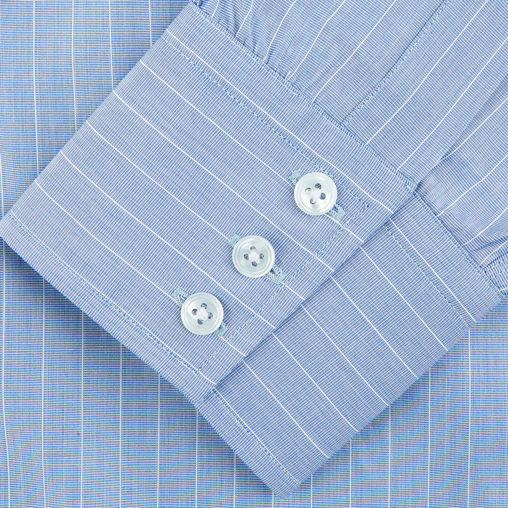 Navy Turnbull & Asser Mayfair shirt in textured cotton, regular fit with a sharp T&A collar and white buttons, laid flat on a white background.