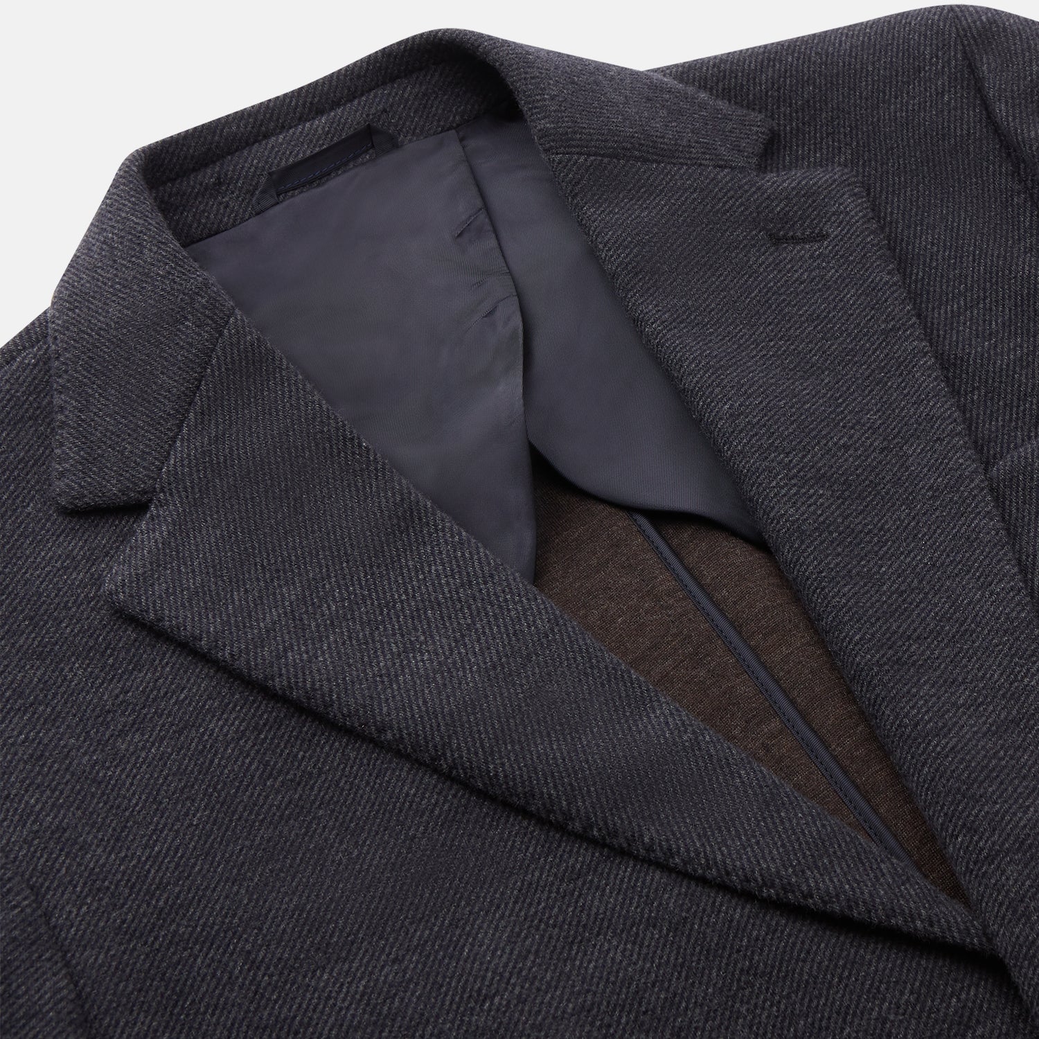 View 2 of product A menswear classic, the Turnbull & Asser Navy Cashmere Blend Henley Blazer features notch lapels, partial lining, two front buttons, and three patch pockets, shown flat on a white background.