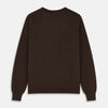 View 3 of product The Turnbull & Asser Brown Cashmere Glenn Jumper is a classic menswear piece with a crew neck and ribbed cuffs, collar, and hem. It’s laid flat on a white background, showcasing its timeless long-sleeved design.