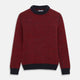 The Turnbull & Asser Red and Navy Wool Blend Billy Jumper features a red knit body with navy ribbed collar, cuffs, and hem, made from a wool and cotton blend, shown on a white background.
