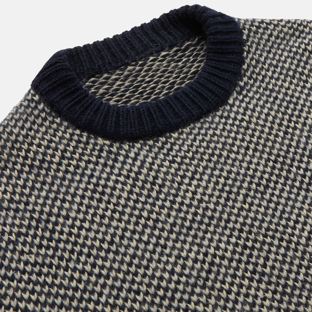 The Turnbull & Asser Navy and White Wool Blend Billy Jumper features a small checkered pattern with ribbed black collar, cuffs, and hem. Shown laid flat on a white background.