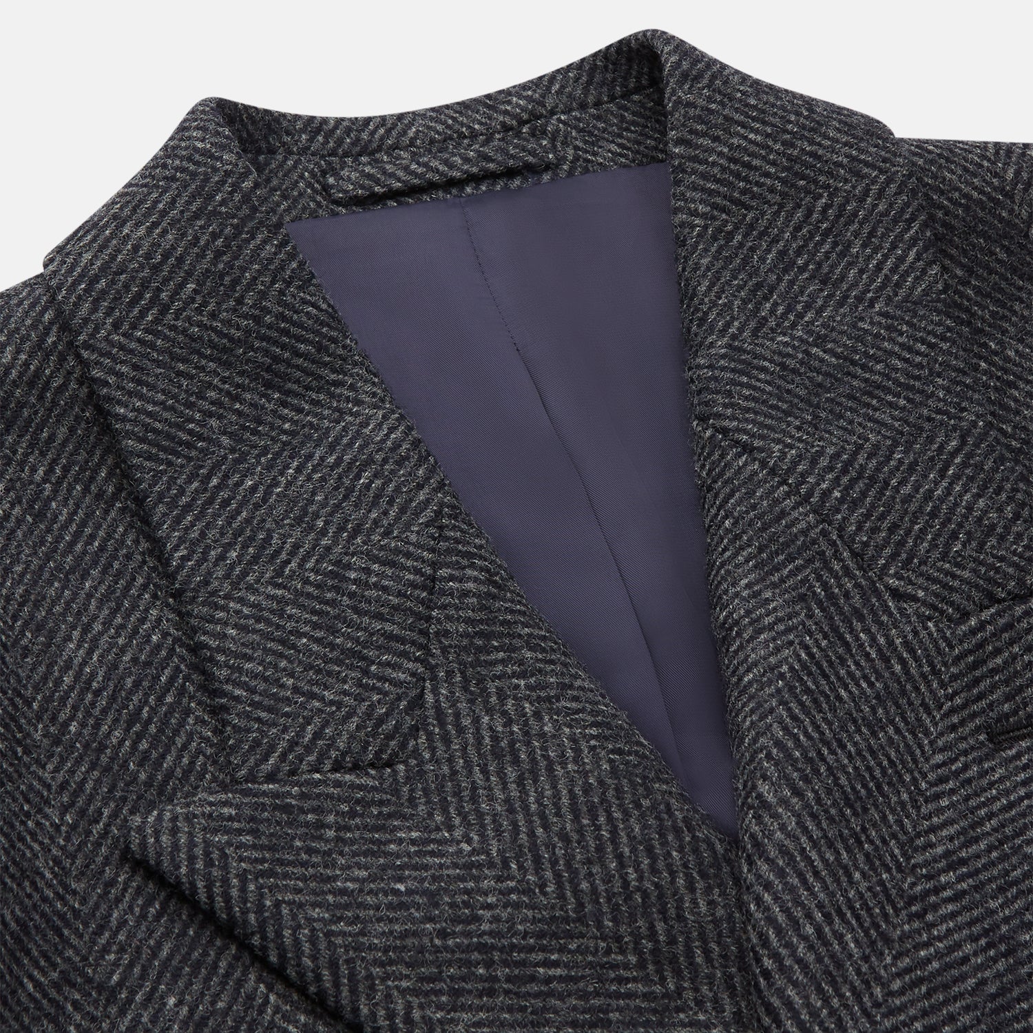 View 3 of product The Grey Herringbone Wool Double Breasted Highgrove Overcoat by Turnbull & Asser features black buttons, a notched lapel, and side pockets, shown against a plain white background.