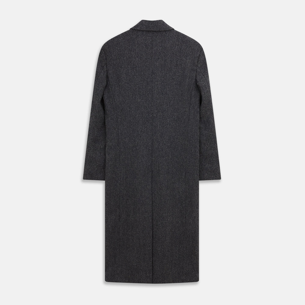 The Grey Herringbone Wool Double Breasted Highgrove Overcoat by Turnbull & Asser features black buttons, a notched lapel, and side pockets, shown against a plain white background.