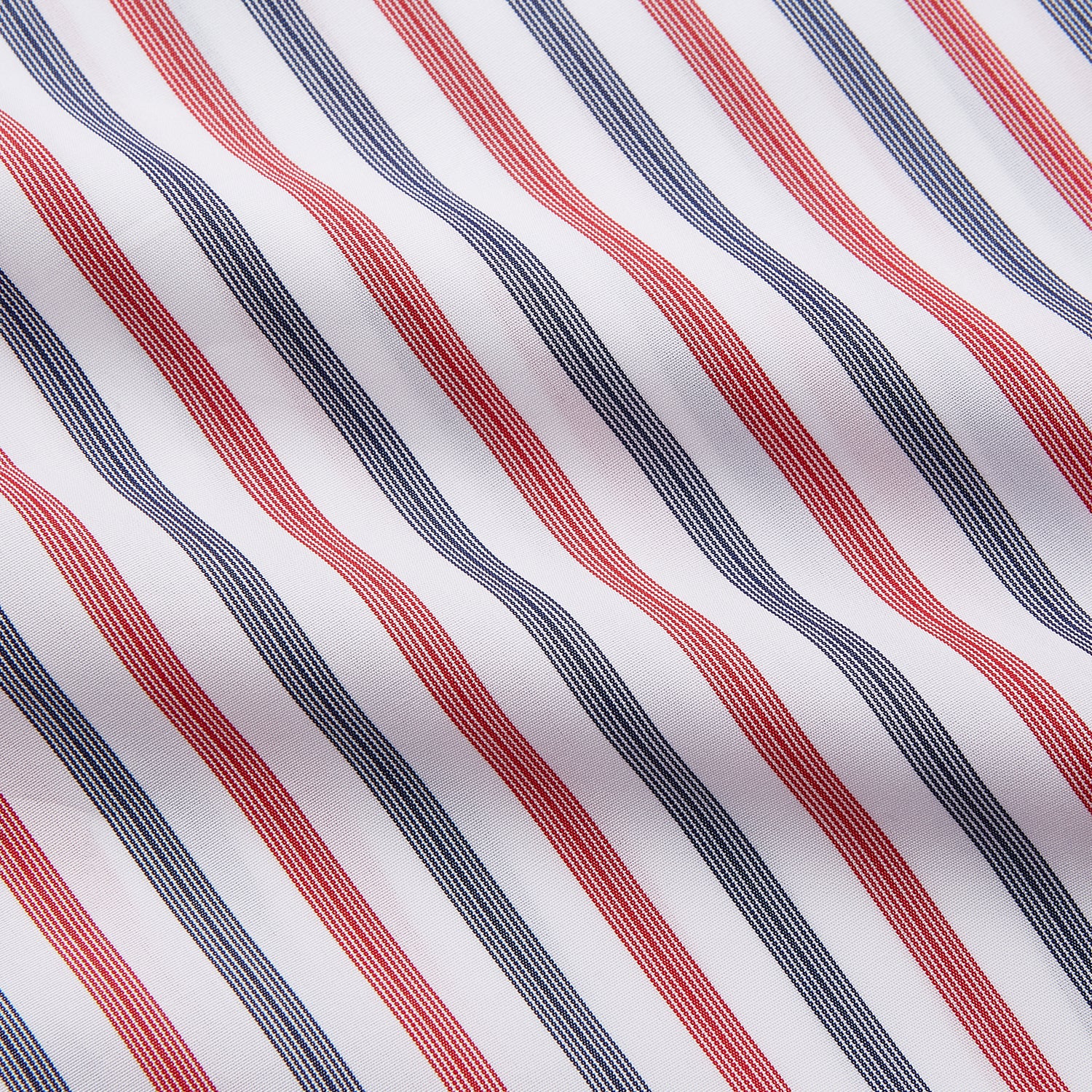 View 3 of product The Turnbull & Asser Red and Blue Stripe Cotton Quin Pyjamas feature a collared, long-sleeve button-up top with black piping and chest pocket, paired with matching striped pants for luxurious comfort and style.