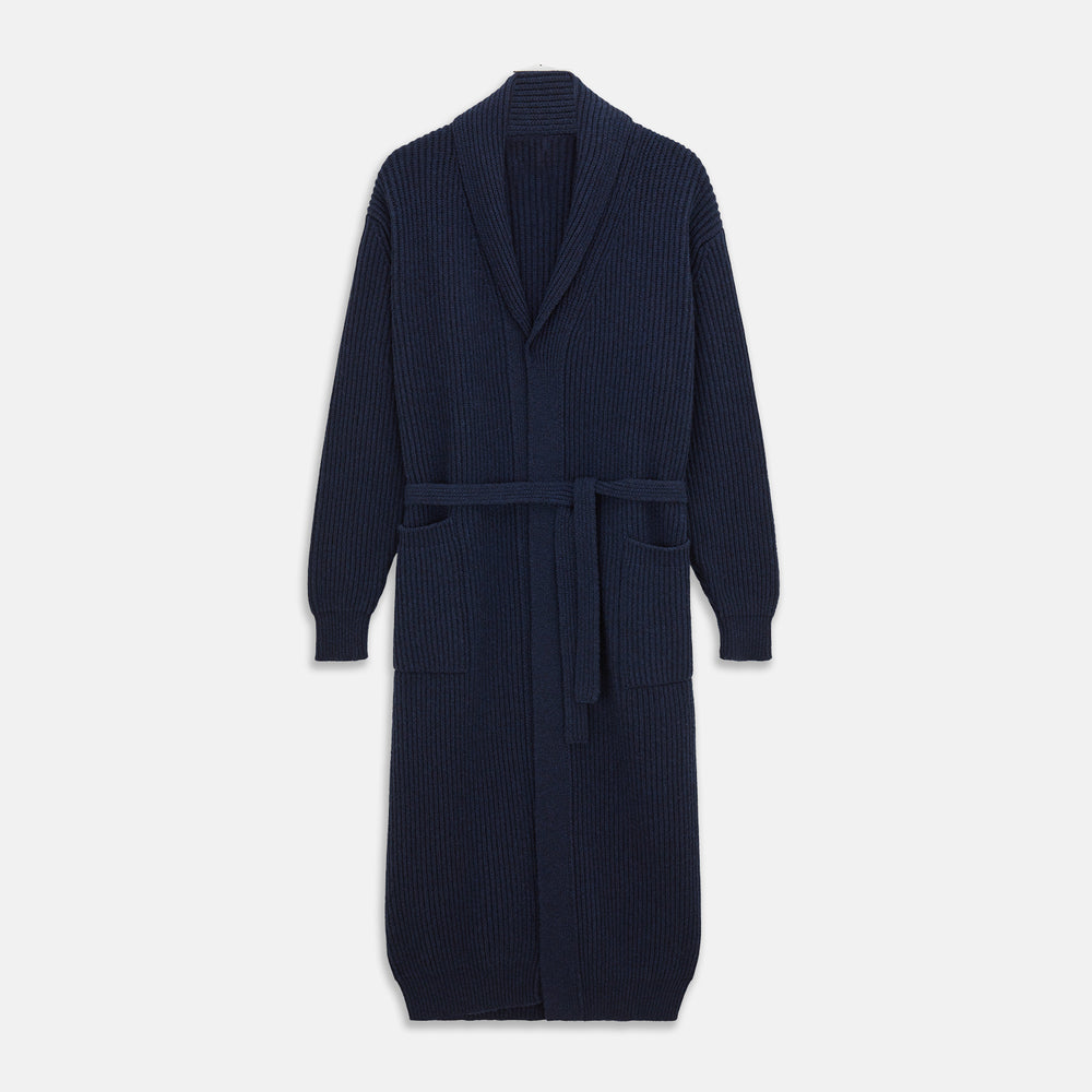 The Deep Navy Cashmere Baldwin Gown by Turnbull & Asser features a ribbed knit, long sleeves, shawl collar, two front pockets, and a waist tie—ideal as luxury loungewear or a chic navy dressing gown.