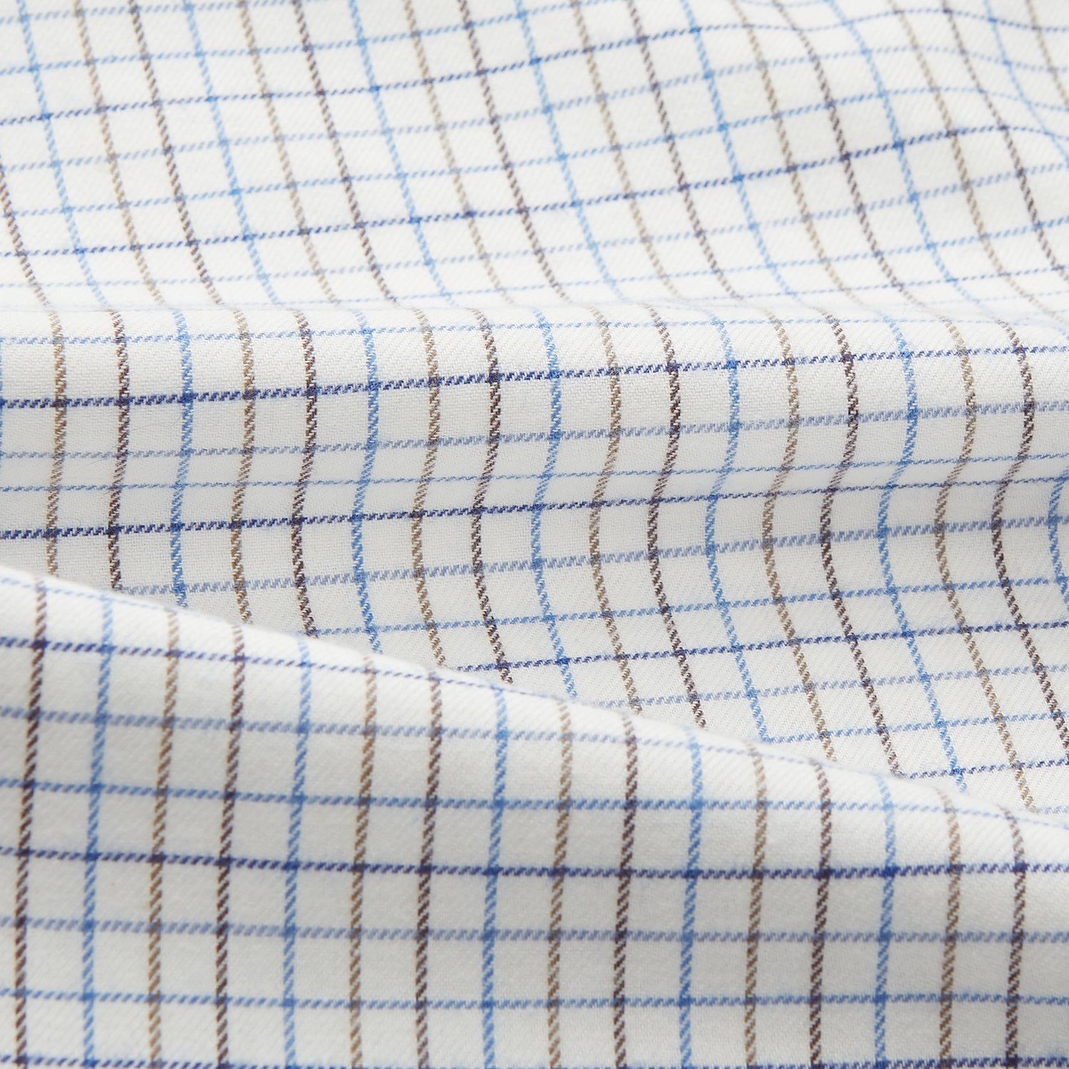 View 4 of product The Turnbull & Asser Blue Tattersall Check Cashmerello Regular Fit Mayfair Shirt is a long-sleeve button-up with a collar and chest pocket, featuring a white base and blue checks, shown laid flat on a white background.