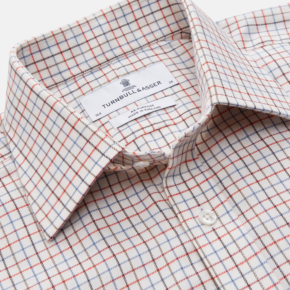The Pink Tattersall Check Cashmerello Regular Fit Mayfair Shirt by Turnbull & Asser features a T&A collar and a red, blue, and white check pattern. The long-sleeve shirt is displayed flat against a white background.