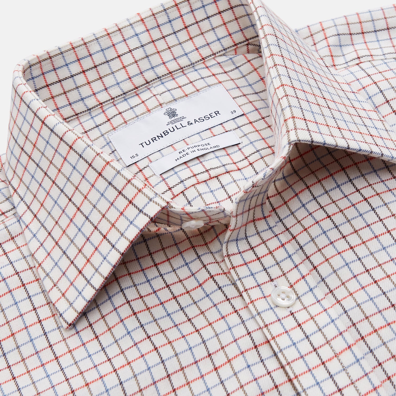 View 4 of product The Pink Tattersall Check Cashmerello Regular Fit Mayfair Shirt by Turnbull & Asser features a T&A collar and a red, blue, and white check pattern. The long-sleeve shirt is displayed flat against a white background.