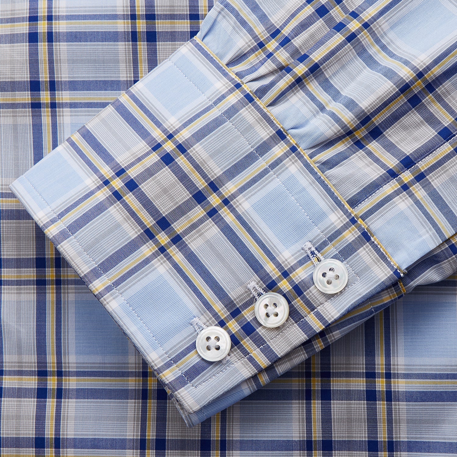 View 2 of product The Turnbull & Asser Blue and Yellow Check Cotton Regular Fit Mayfair Shirt for men is displayed laid flat on a white background.