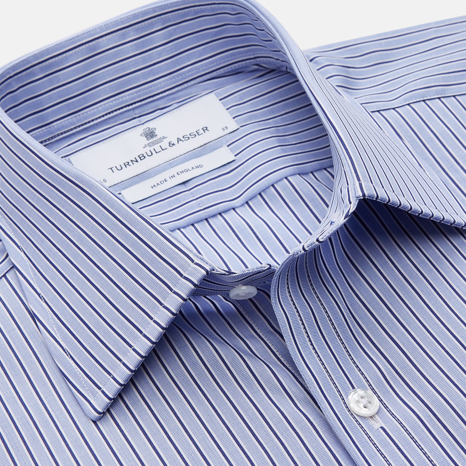View 3 of product The Blue and Navy Halo Stripe Cotton Regular Fit Mayfair Shirt by Turnbull & Asser features classic styling with vertical stripes, a button-up front, and cuffed sleeves—an essential men's wardrobe piece.