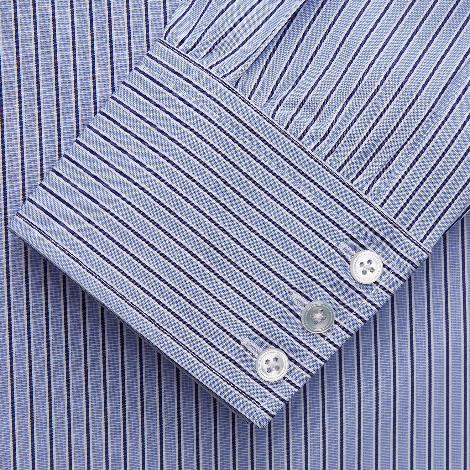 View 2 of product The Blue and Navy Halo Stripe Cotton Regular Fit Mayfair Shirt by Turnbull & Asser features classic styling with vertical stripes, a button-up front, and cuffed sleeves—an essential men's wardrobe piece.