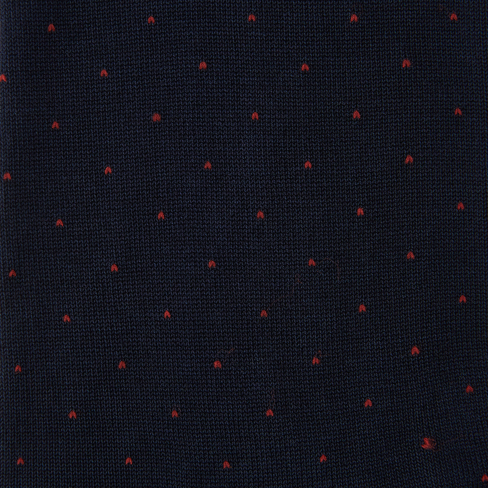 The Turnbull & Asser Navy and Red Polka Dot Cotton Mid-length Sock features small, evenly spaced dots—perfect for adding a stylish touch to your wardrobe.