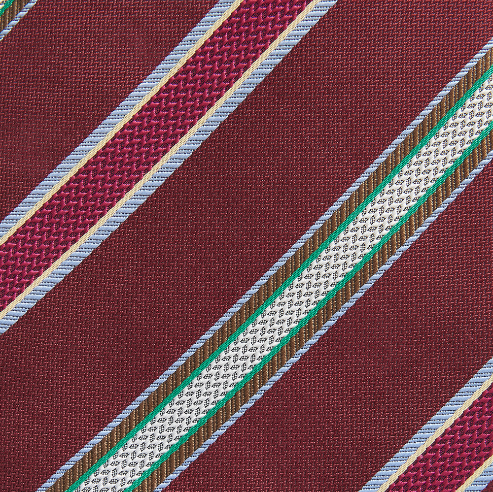 A Turnbull & Asser Burgundy Multi Stripe Silk Tie, featuring diagonal white, green, and blue stripes, is rolled up and displayed on a plain white background.