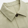 View 2 of product The Turnbull & Asser Tan Organic Cotton Blend Remy Chore Jacket features long sleeves, a collar, button-down front, and three pockets—an essential for any men’s wardrobe. The jacket is shown laid flat on a white background.