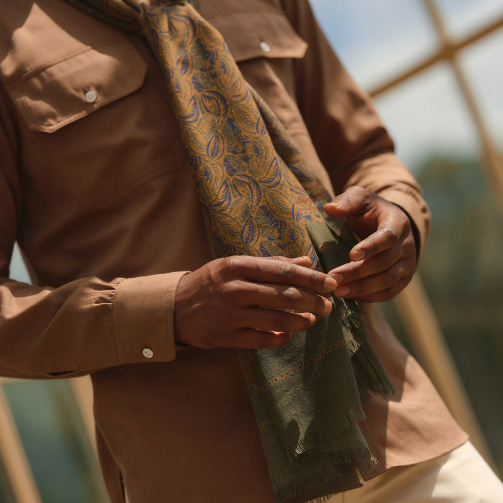 The Turnbull & Asser Brown Military Weekend Fit Cotton & Wool Shirt features a stand collar, 1-button cuffs, and two chest flap pockets; shown laid flat on a white background.