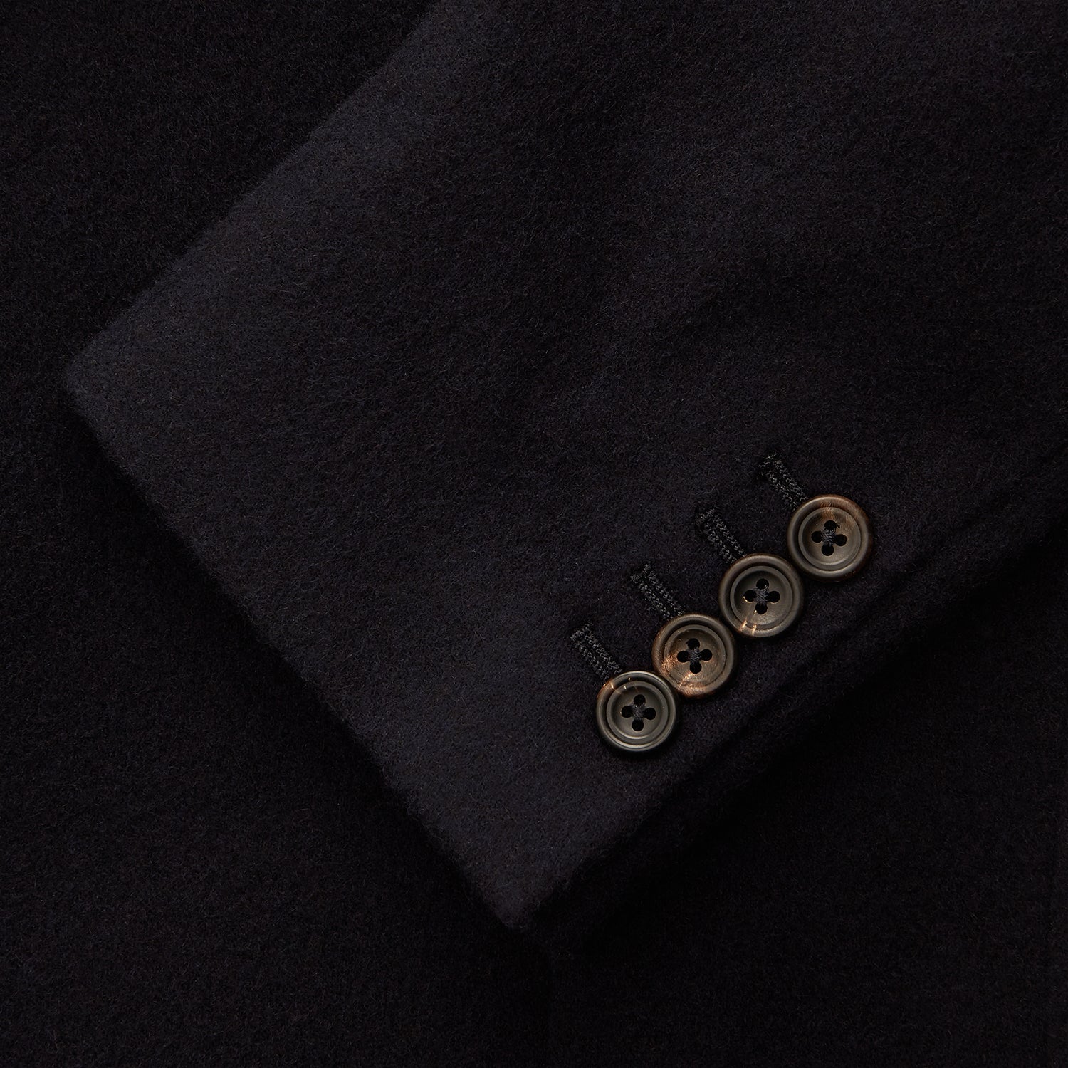 View 3 of product The Turnbull & Asser Navy Cashmere Bern Blazer features a notched lapel, two-button front, three front pockets, and cuff button details. Shown laid flat on a white background.