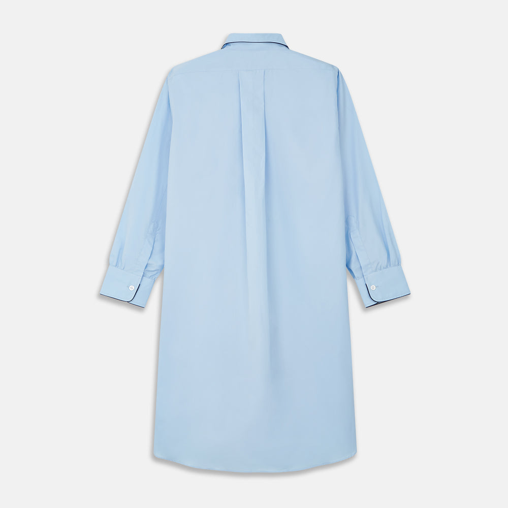 The Turnbull & Asser Light Blue Piped Cotton Nightshirt is a luxurious long-sleeve shirt dress with a pointed collar, black piping on the collar, cuffs, and chest pocket, button front closure, and curved hem.