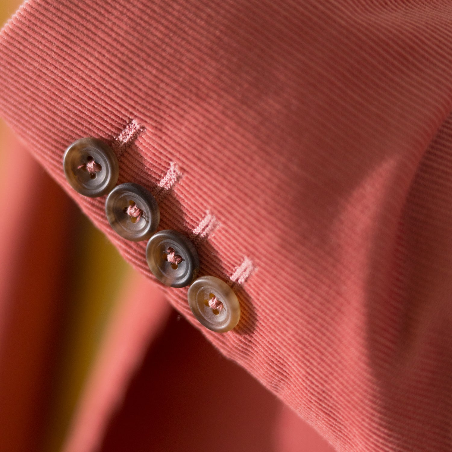 View 5 of product The Turnbull & Asser Pink Cord Bern Blazer features notch lapels, two brown buttons, three front pockets, and buttoned cuffs, showcasing Italian tailoring against a plain white background.