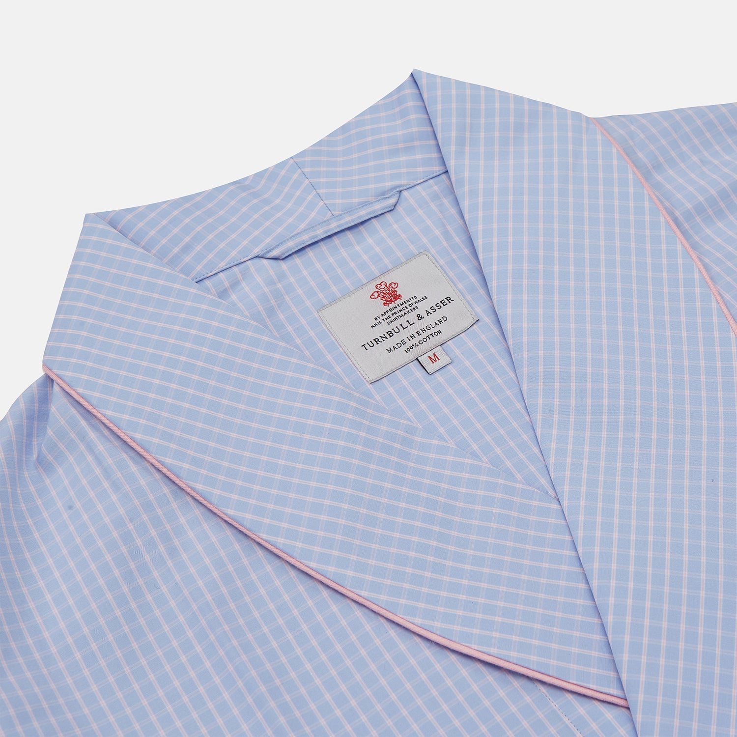 View 2 of product The Turnbull & Asser Blue & Pink Poplin Cotton Check Dressing Gown features a wide collar, pink trim, and a front sash—stylish and compact enough to pack for your next trip.