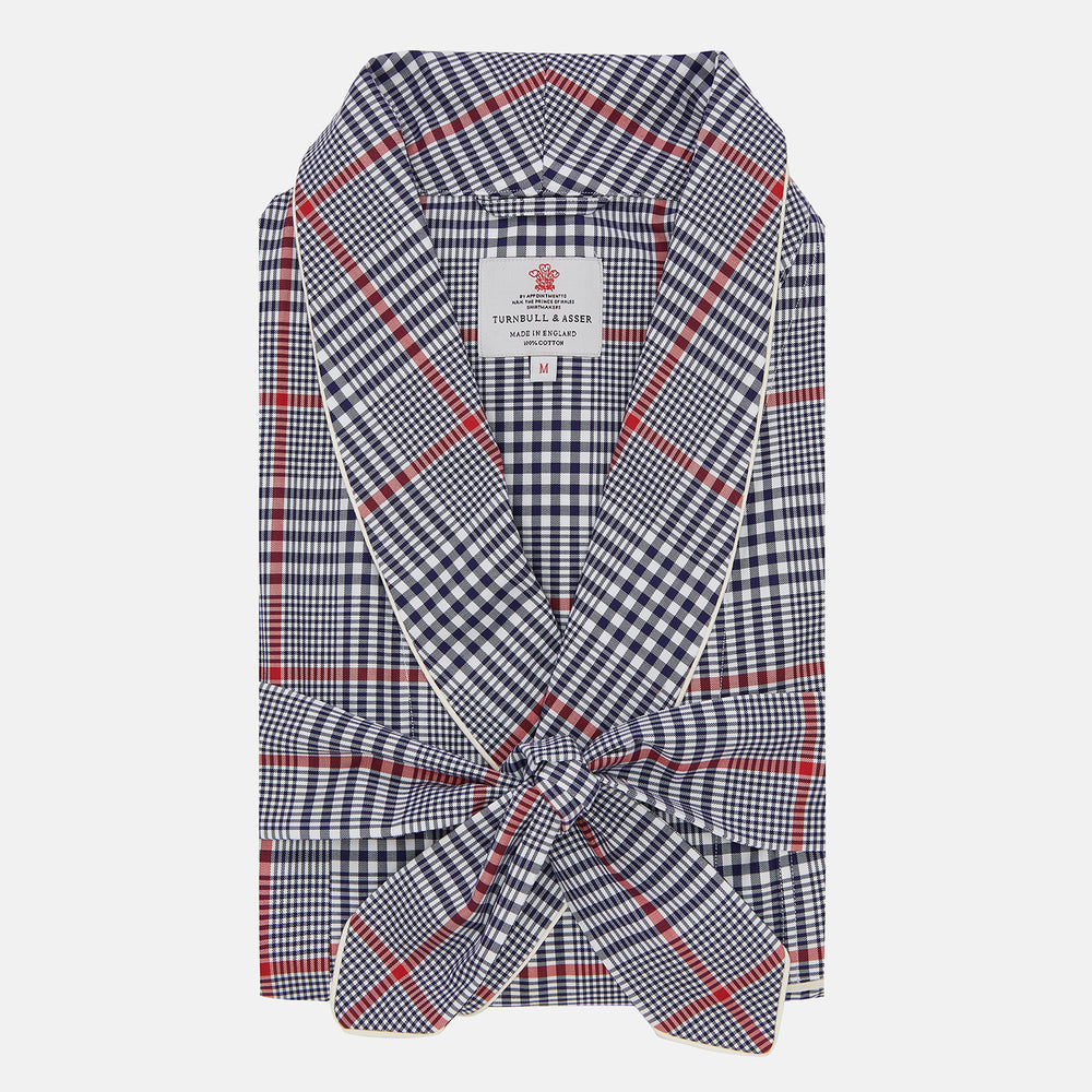 The Navy and Red Archive Check Cotton Dressing Gown by Turnbull & Asser features a shawl collar, tied waist, and classic check pattern. Made in England—ideal for travel.
