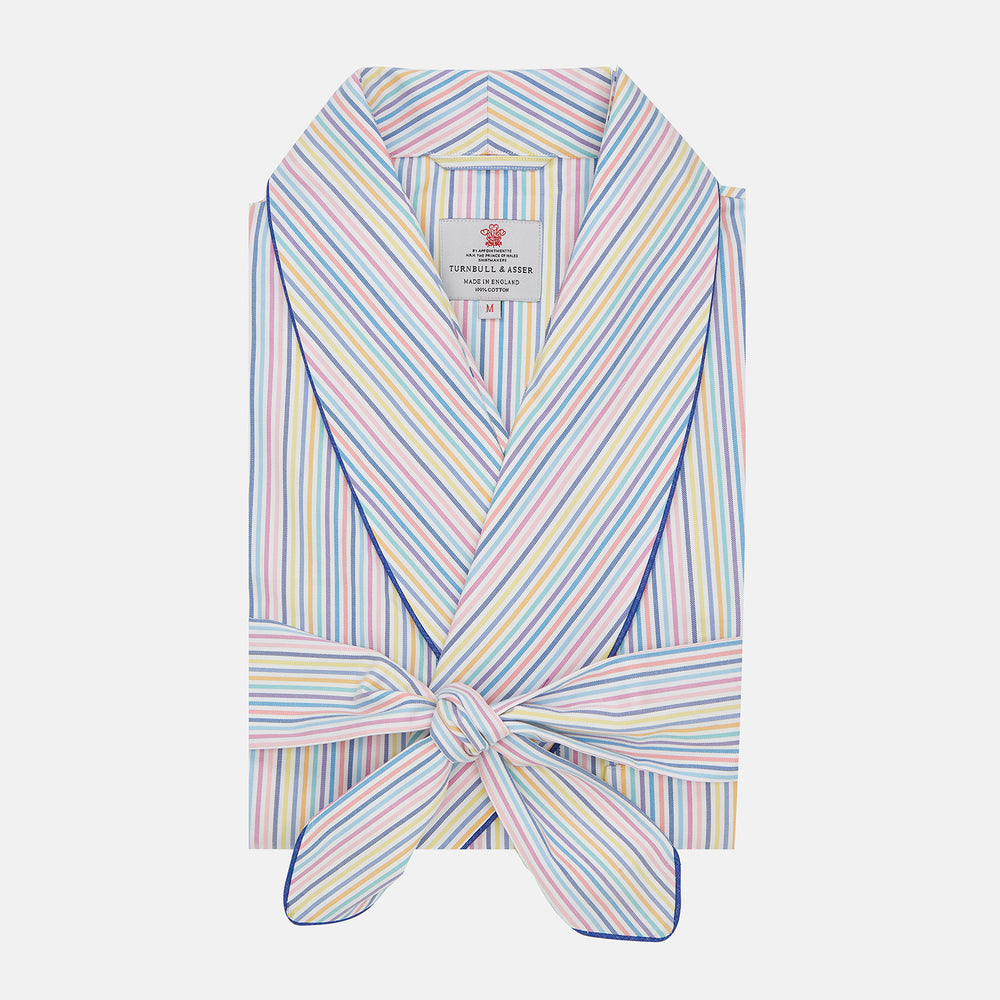 The Turnbull & Asser Multi-coloured Twill Cotton Stripe Dressing Gown features pastel blue, yellow, pink, and white stripes, a shawl collar, and belt—perfect for stylish comfort—shown neatly folded against a plain white background.