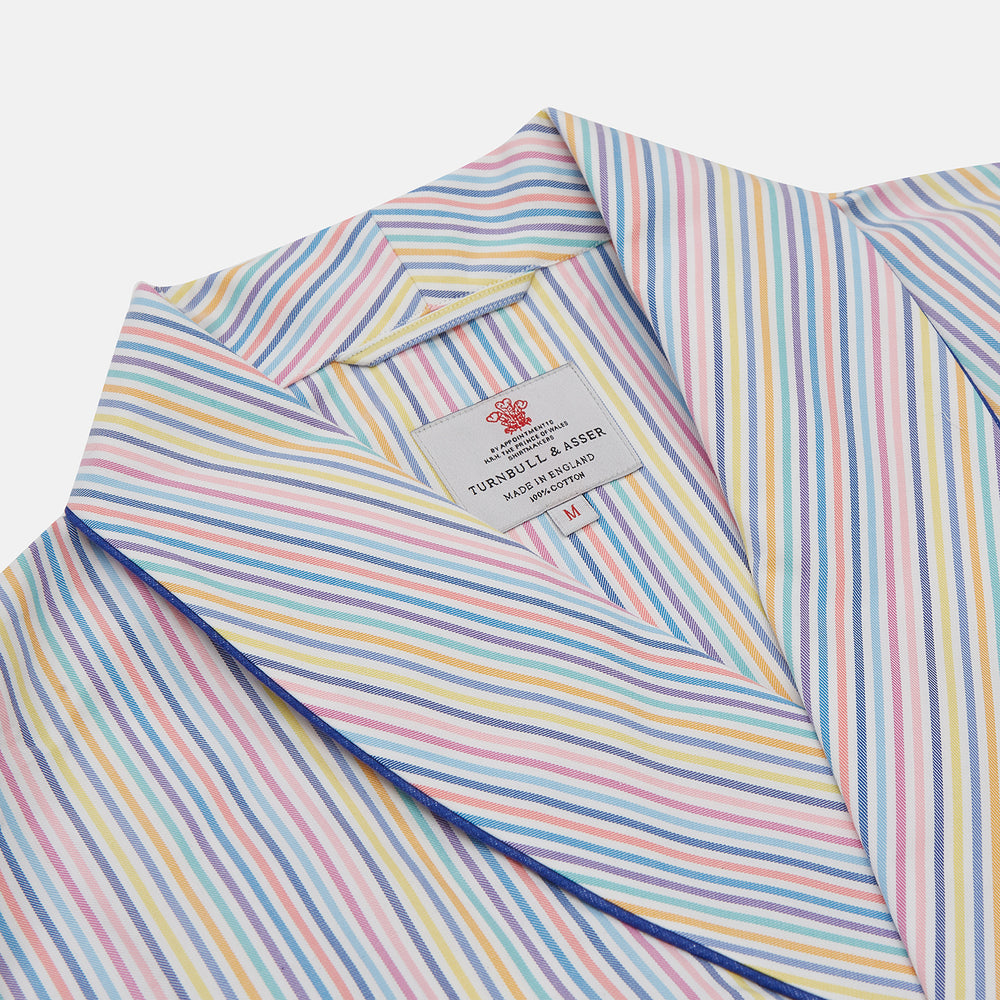The Turnbull & Asser Multi-coloured Twill Cotton Stripe Dressing Gown features pastel blue, yellow, pink, and white stripes, a shawl collar, and belt—perfect for stylish comfort—shown neatly folded against a plain white background.