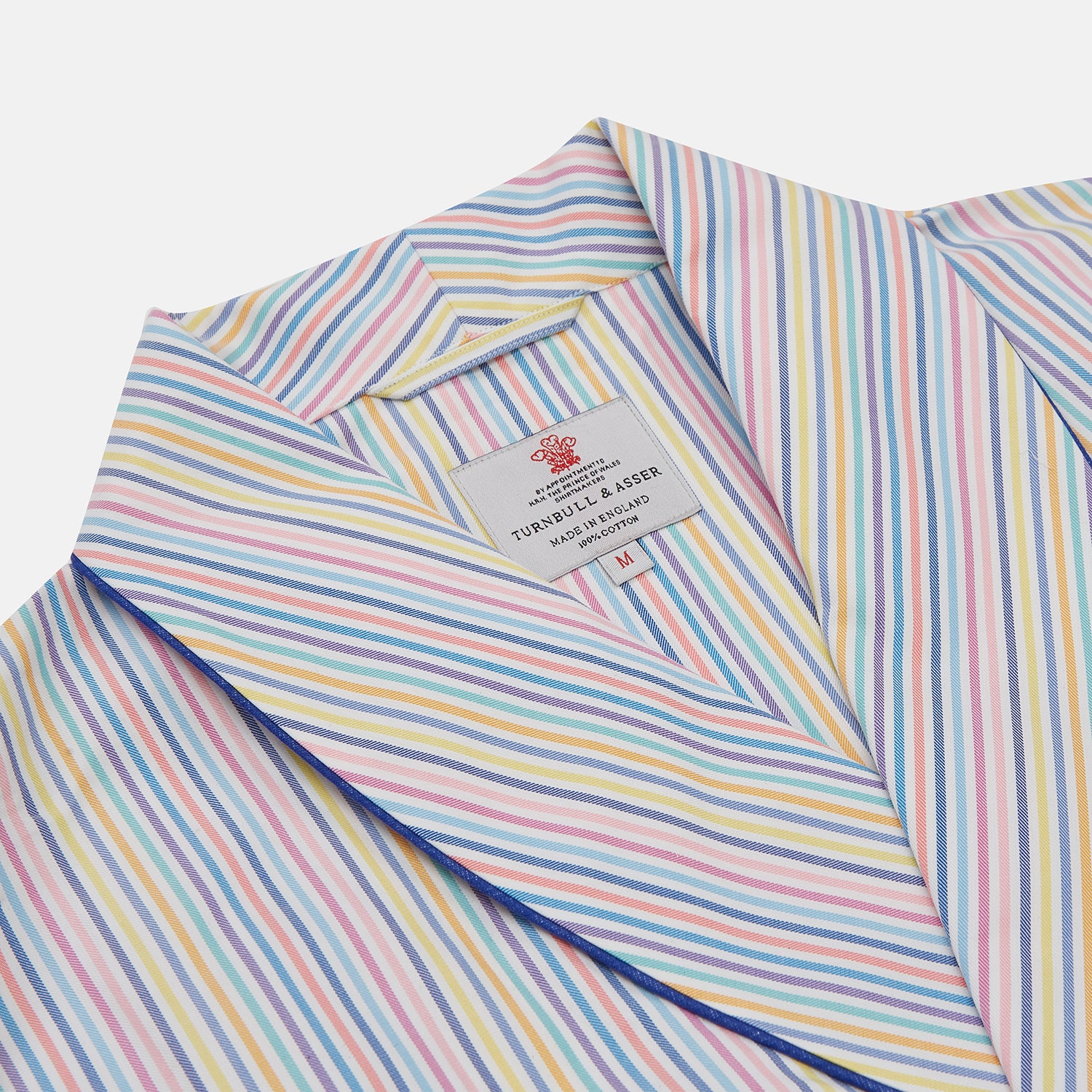 View 2 of product The Turnbull & Asser Multi-coloured Twill Cotton Stripe Dressing Gown features pastel blue, yellow, pink, and white stripes, a shawl collar, and belt—perfect for stylish comfort—shown neatly folded against a plain white background.