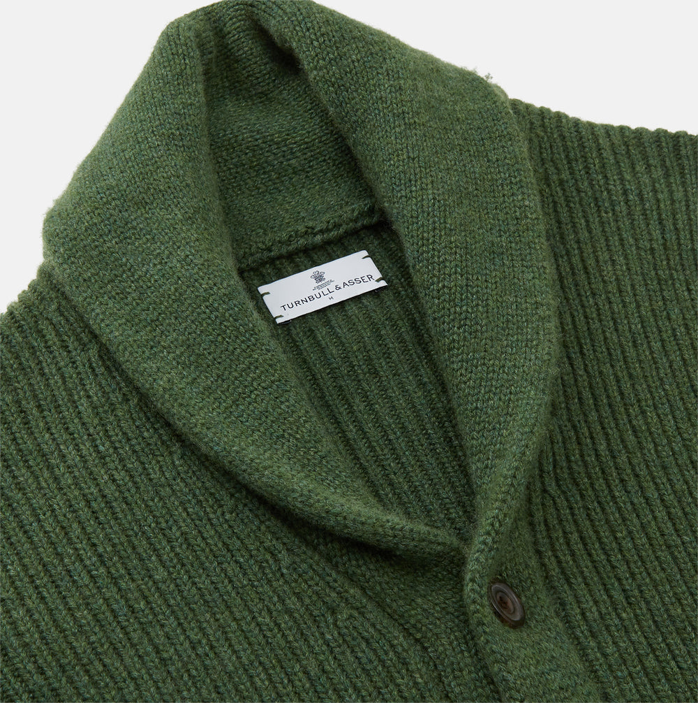The Turnbull & Asser Serpentine Green Ribbed Cashmere Ainsley Cardigan features a button-up front, two pockets, and a shawl collar, shown laid flat on a white background.