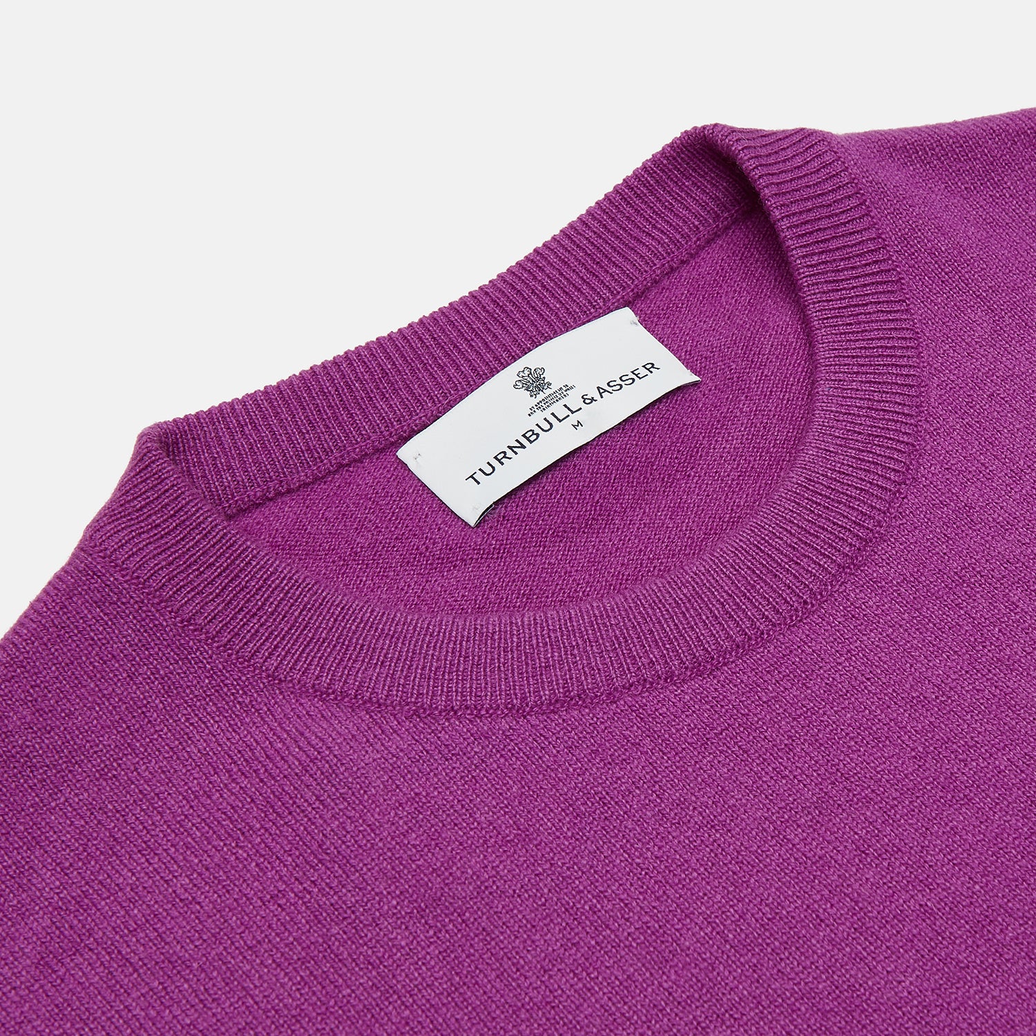 View 2 of product The Turnbull & Asser Magenta Cashmere Crewneck Jumper, featuring ribbed cuffs, hem, and collar, is shown against a plain white background.